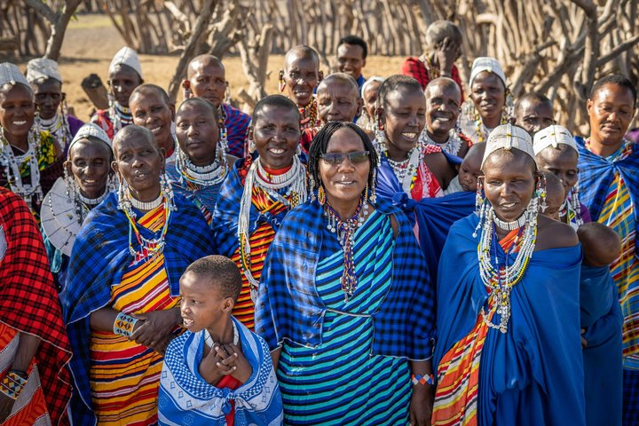 Pastoral Women's Council Co-Founder and Executive Director Maanda Ngoitiko and founding council members stand together.